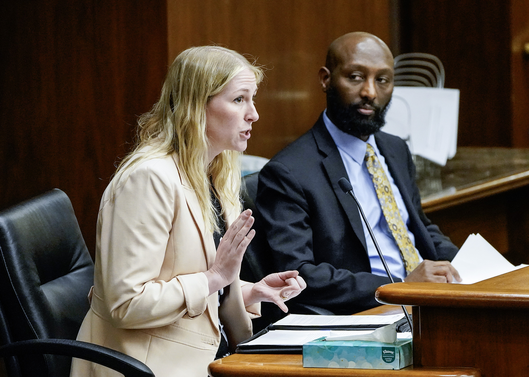 Shana Tomenes, staff attorney for University of Minnesota Student Legal Service, testifies for a bill sponsored by Rep. Mohamud Noor, right, that would provide tenant remedies related to new construction delays. (Photo by Andrew VonBank)